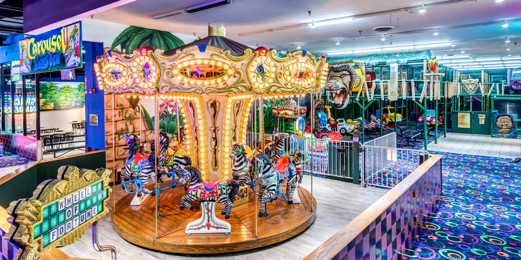 A carousel with many people inside of it